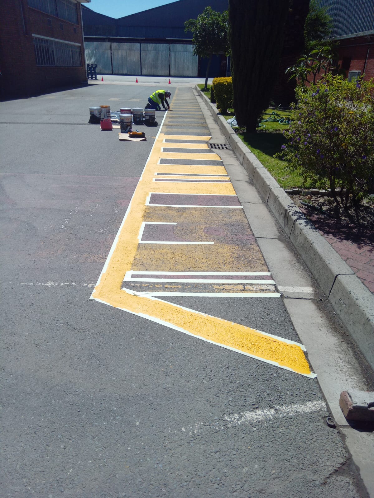 Pedestrian walkway striping in progress